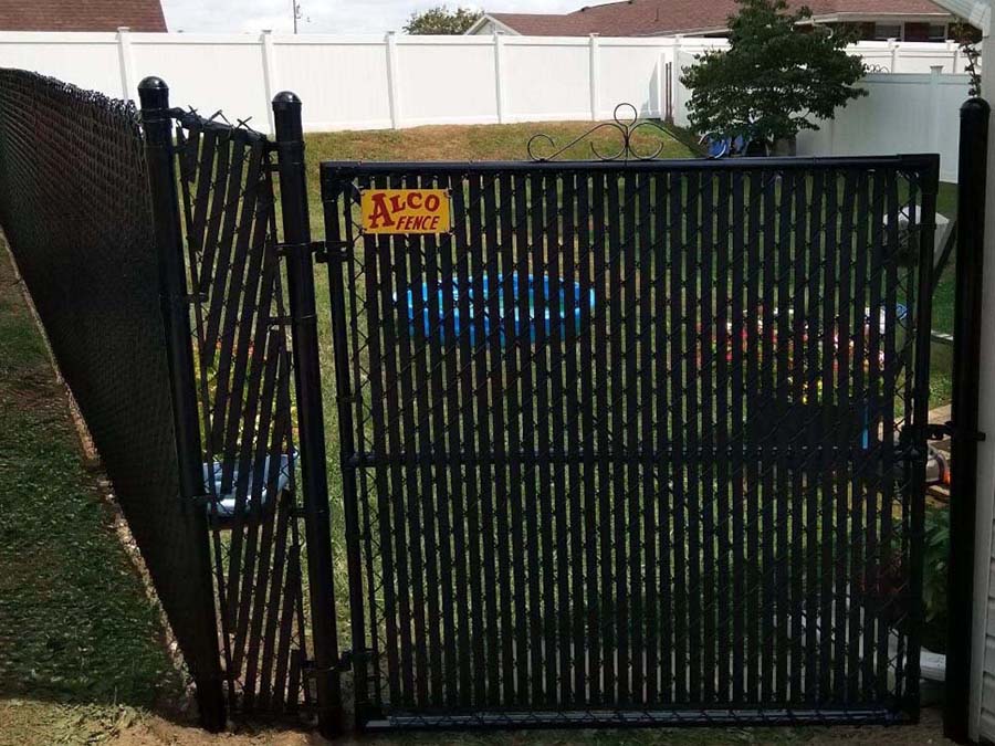 Fence with Chain Link fence with semi-privacy slats in Morgantown West Virginia in West Virginia