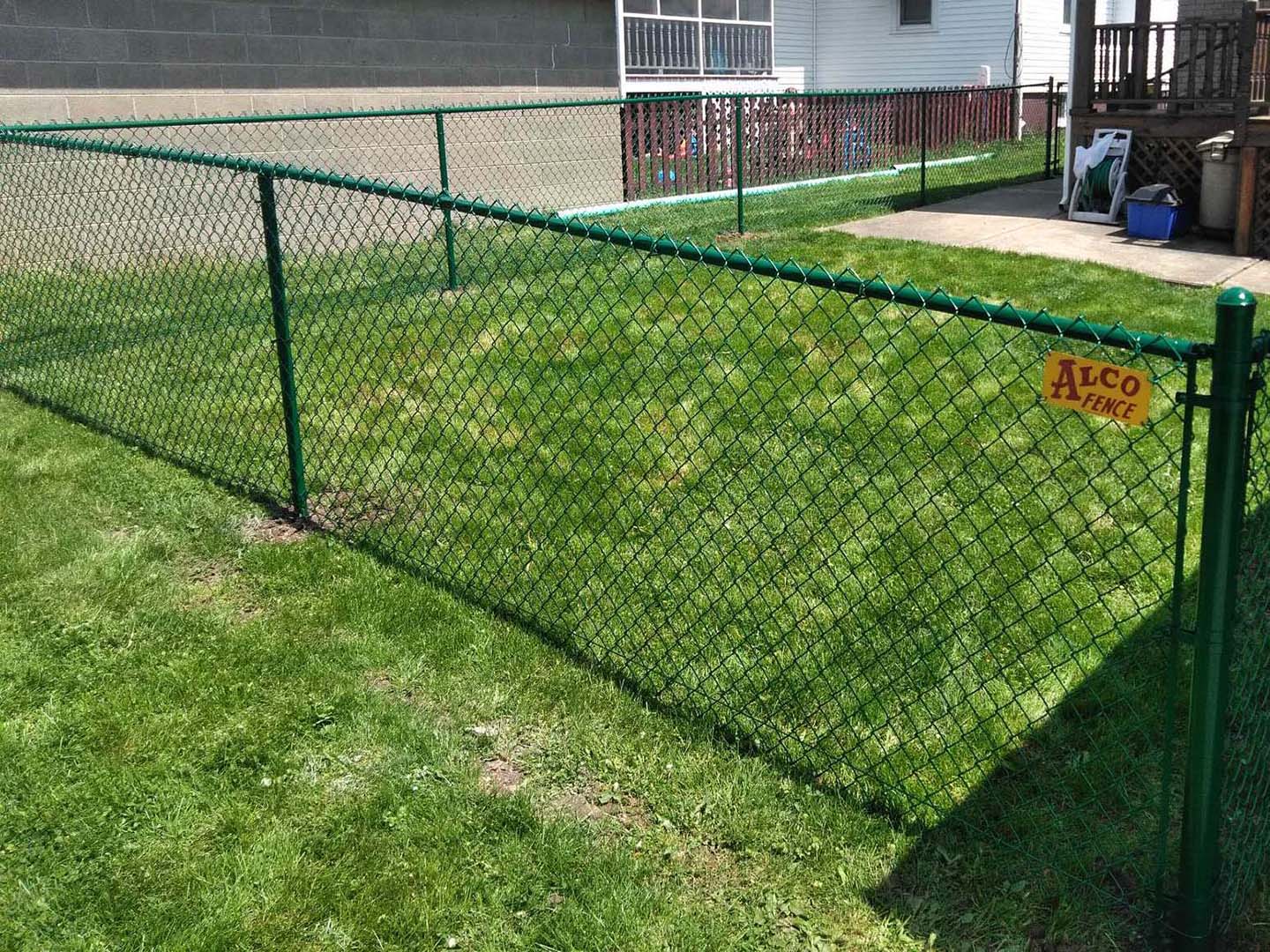 Fence with Green Chain Link Fence Installation Company for Residential Properties in Morgantown West Virginia in West Virginia