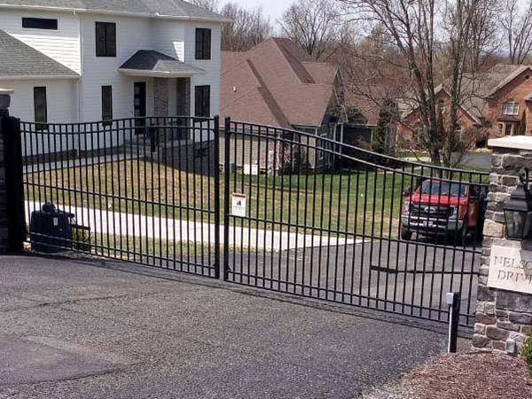 Fence with automated double swing estate gate with brick columns Installation Company in Morgantown West Virgin in West Virginia