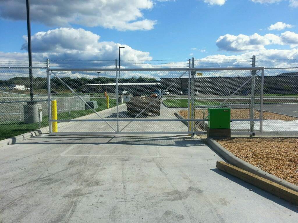 Fence with Chain link sliding gate with barbed wire and access control installed in West Virginia in West Virginia