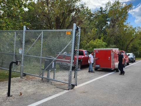 Fence with Sliding chain link gate with gate operator installed for access to a road in West Virginia in West Virginia